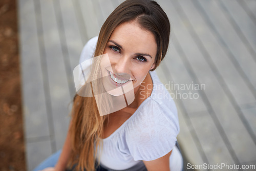 Image of Portrait, young woman or happy in outdoor in city, relax or travel adventure for wellness on holiday. French person, face or smile in urban town on summer vacation, above or satisfaction in france