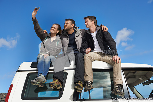 Image of Friends, car and selfie in smile with smartphone for adventure, holiday and road trip to travel in Australia. People, happy and excited for vacation or break with bonding for memory and together.