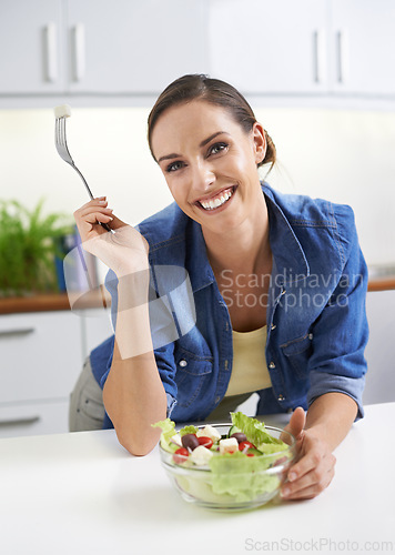 Image of Happy woman, portrait and kitchen with salad bowl for natural nutrition, healthy eating or diet at home. Face of female person or vegetarian with smile for vegetables, vitamins or fiber at the house