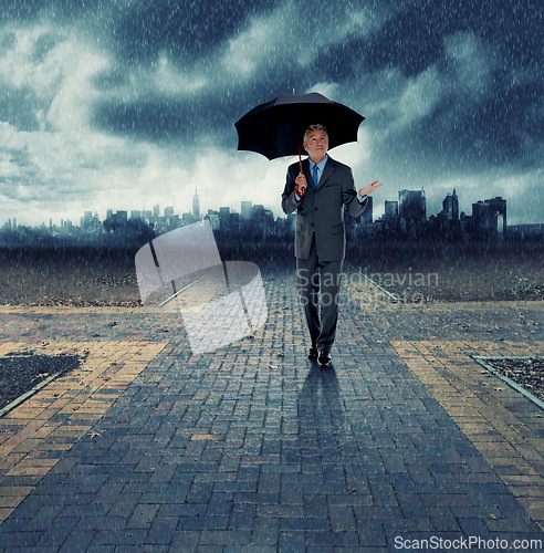 Image of Businessman, umbrella and walking for security in rain, insurance at crossroads by city background for choice. Mature person, winter and street with dark clouds in storm and future decision for path