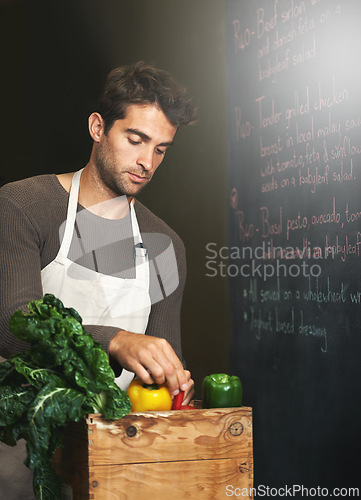 Image of Chef, basket and business owner with vegetables or groceries in a bag for cooking or diet in kitchen. Man packing, shopkeeper and person sorting healthy food dinner or packaging box of ingredients