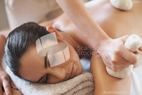 Image of Relax, bag and massage of woman at spa for skincare, peace or calm at luxury resort. Beauty, therapy and masseuse with herbal compress at salon for body treatment, health or hands of person on back