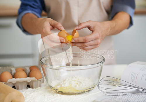 Image of Hands, person and eggs with flour, baking and kitchen for whisk with utensils. Baker, pastry and food with countertop, apron and cookbook for recipe preparation and recreation or hobby at house