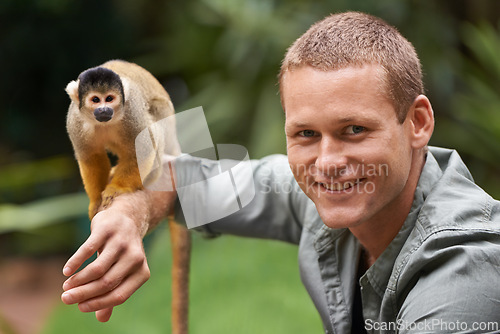 Image of Man, portrait and monkey at nature zoo as sanctuary veterinary for rehabilitation trust, support or protection. Male person, face and animal in sustainable environment in Indonesia, holiday or travel