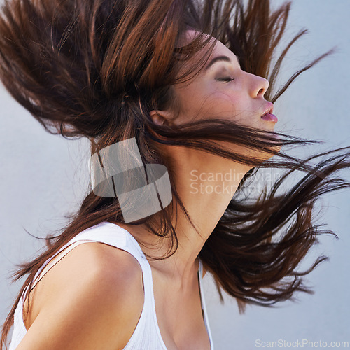 Image of Woman, hair or wind as haircare, hairdressing or keratin as healthy, texture or growth for scalp. Long, natural or hairstyle as grooming for maintennce, shine or volume in studio on white background