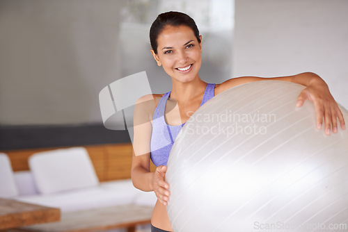 Image of Happy woman, portrait and exercise with ball for pilates, health and wellness at home. Face of female person or yogi with smile for gym equipment, training or workout in sports or wellbeing at house