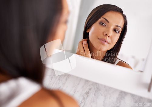 Image of Woman, makeup and skincare in bathroom mirror with beauty, dermatology or happy for face results. Young person with smile in reflection for facial foundation, cosmetics and getting ready at her home