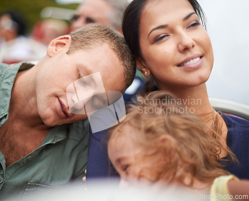 Image of Circus, fun and family in rollercoaster for holiday in USA for cute toddler and happiness in outdoor trip. Amusement park, father and daughter sleeping on mom with smile, love and care in ride
