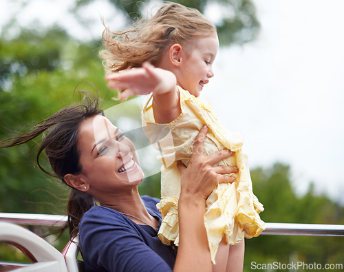 Image of Ride, mother and child with happiness in amusement park for freedom in rollercoaster in summer. Nature, woman and girl together for fun, joy and outdoor in circus for growth and development of kid