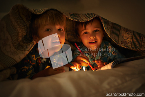 Image of Blanket, flashlight and portrait of children at night with happiness, drawing in a book. Friends, relax and sketch on notebook in dark with light or torch under duvet at sleepover with a pillow tent