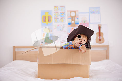 Image of Home, telescope or costume as pirate to play in boat boxes or fantasy in bedroom or house. Kid hiding, child captain or boy in an adventure game with cardboard or creative monocular to sail on ship