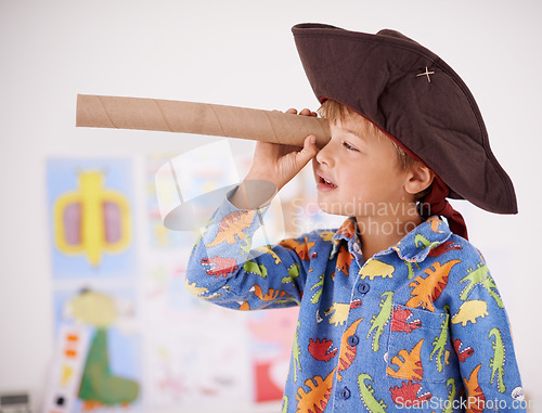 Image of House, telescope or costume as pirate to play in fantasy in his bedroom with vision toy or creativity. Kid sailor, child captain or young boy in a game with pyjamas, hat or monocular to sail on bed