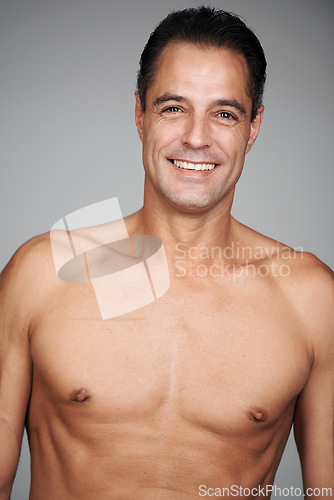 Image of Man, shirtless and smile for strength, strong and health for growth and development in body. Mature person and happy with confidence for chest, muscular and masculine for wellness, fit and care