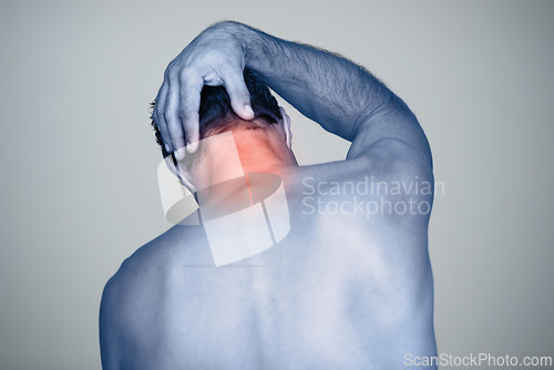 Image of Neck pain, injury and man with tension, inflammation and discomfort from stress, strain and pressure in back view. Male person, body and red glow for wound, bruise and trauma in studio background