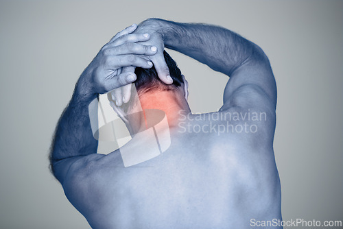 Image of Studio, man and hands for neck pain or tension with muscle inflammation, discomfort and sprain of stress or strain. Red glow, back view and person with body ache, injury and bruise on grey background