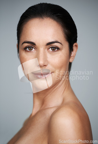 Image of Women, studio and portrait with proud, skin and care for treatment and beauty. Model, cosmetics and natural with lip gloss, glow and aesthetic for antiaging confidence isolated on grey background