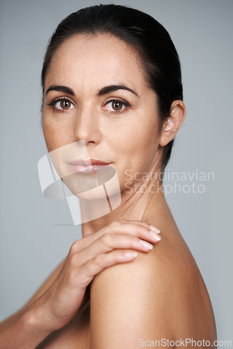 Image of Woman, studio and portrait with beauty, skin and care for treatment and proud. Model, cosmetics and natural with lip gloss, glow and aesthetic for antiaging confidence isolated on grey background