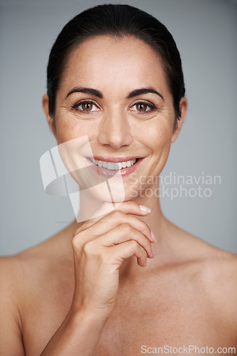 Image of Woman, studio and smile with thinking, skin and care for treatment and proud. Model, cosmetics and natural with lip gloss, glow and portrait for antiaging confidence isolated on white background