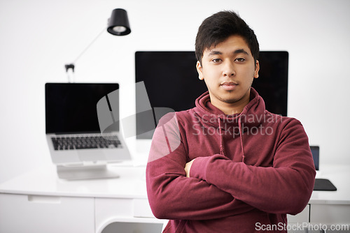 Image of Laptop, portrait and man on software for update in office with information technology for cybersecurity. Coder, programmer and male person with arms crossed in workplace with monitor of computer