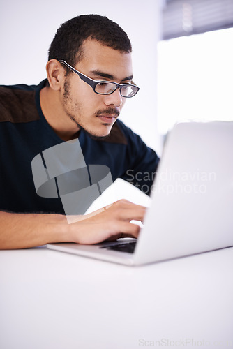 Image of Elearning, glasses and man typing on laptop for research, study or opportunity for university education. Computer, knowledge and college student with online course for programming, software or coding