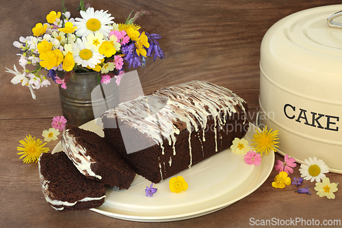 Image of Sliced Chocolate Chip Cake with Spring Flowers