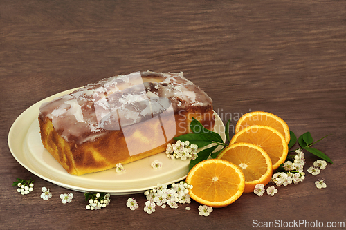 Image of Orange Drizzle Cake with Fruit and Spring Blossom