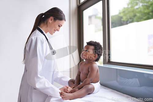 Image of Clinic, pediatrician and woman with baby, boy and checkup with wellness and doctor in an exam. Medical, professional and employee with healthcare and infant with appointment and medicare with smile