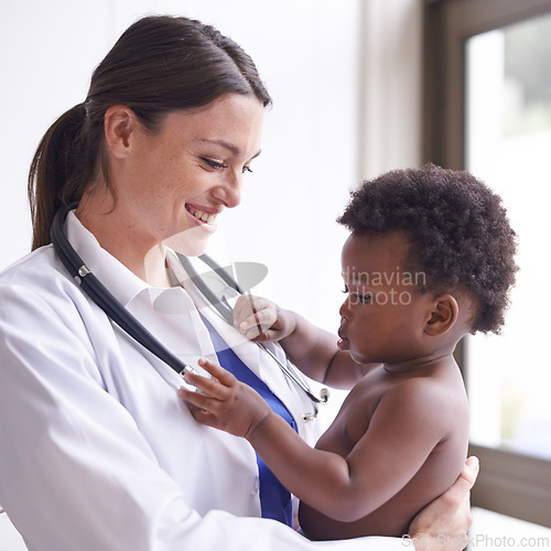 Image of Happy, pediatrician and woman with baby, boy and checkup with stethoscope and doctor in clinic. Medical, professional and employee with healthcare or infant with appointment or medicare with wellness