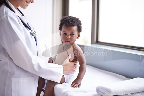 Image of Baby, pediatrician and healthcare wellness or consultation as childhood development checkup, examination or ill. Patient, kid and medic support on hospital bed in Kenya for diagnosis, flu or clinic