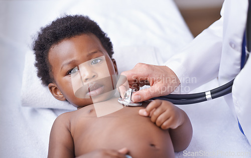 Image of Baby, portrait and pediatrician with stethoscope consultation or lung infection or diagnosis, heartbeat or listening. Child, boy and face on hospital bed or healthcare checkup in Kenya, clinic or ill
