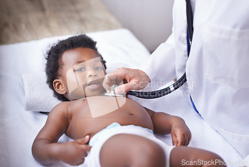 Image of Baby, portrait and pediatrician with stethoscope for heartbeat consultation or lung infection, listening or checkup. Child, boy and face on hospital bed or healthcare wellness in Kenya, clinic or ill