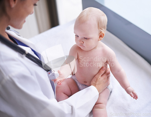 Image of Baby, pediatrician and stethoscope for heartbeat consultation or lung infection, examination or checkup. Child, boy and hospital bed or healthcare wellness clinic for diagnosis, sickness or results