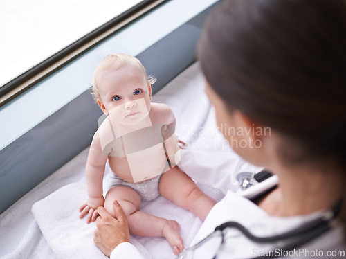 Image of Baby, portrait and pediatrician consultation for healthcare checkup on hospital bed for diagnosis, insurance or childcare. Kid, face and medical worker for sick treatment, examination or stethoscope