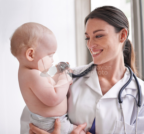 Image of Stethoscope, pediatrician and woman with baby, boy and checkup with wellness and healthcare in clinic. Medical, professional or employee with smile or infant with appointment and medicare with doctor