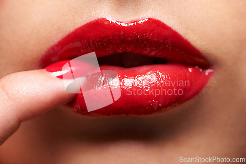 Image of Makeup, red lipstick and closeup of woman lips with trendy, beauty and manicure treatment. Mouth, cosmetics and zoom of female person with gloss for shine and nail polish for cosmetology routine.