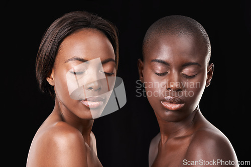 Image of Studio, skin care and wellness of friends, cosmetics and foundation on black background. Sisterhood, African women and together for dermatology or facial treatment, confidence and proud of glow