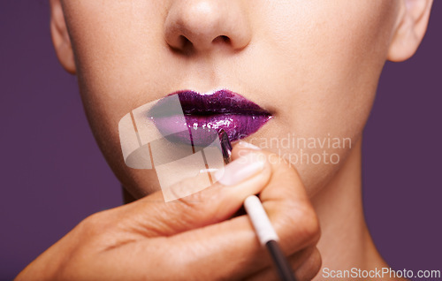 Image of Lipstick, beauty and mouth of woman on purple background for makeup, cosmetics and products. Salon aesthetic, creative and closeup of lips of person with lipgloss, shine and cosmetics in studio