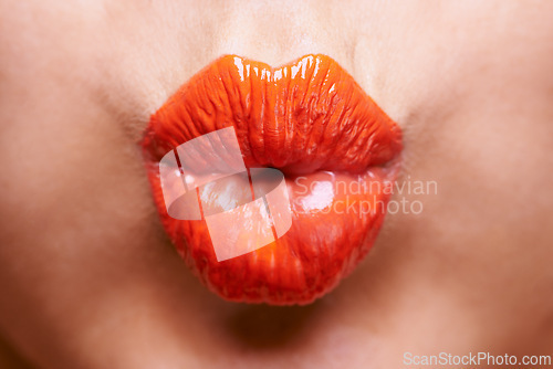 Image of Lipstick, beauty and mouth of woman with kiss for makeup, cosmetics and products on background. Salon, cosmetology and pout closeup of person with lip gloss, shine and creative aesthetic in studio