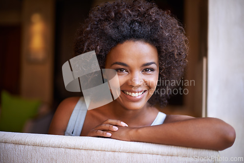 Image of Smile, sofa and portrait of woman in living room for weekend rest, break or afternoon free time. Relax, happy and face of black female person on couch with positive mood, satisfaction and enjoyment