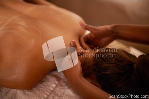 Image of Woman, hands and massage on bed at hotel spa for peace, stress relief and luxury wellness. Relax, masseuse and zen female client with body care for vacation, holiday and calm physical therapy