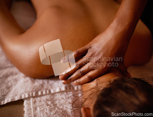 Image of Spa, hand and back massage with woman on bed for luxury pampering, stress relief or treatment from above. Skincare, relax and wellness with customer at resort or salon for holistic therapy closeup