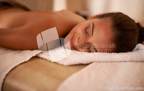 Image of Peace, calm and woman in spa to relax for vitality or wellbeing, luxury and pamper for body care or treatment. Female person, resort and carefree after massage therapy for wellness and relaxation.