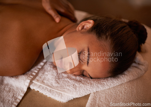 Image of Face, massage and relax with woman at spa as customer for luxury pamper treatment or wellness. Beauty, peace and skincare with back of young person on bed or table at salon for natural stress relief