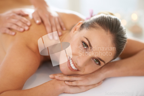 Image of Woman, portrait and smile for body massage or spa treatment stress relief at resort, physical therapy or peace. Female person, face and hands or relax service in Hawaii or skincare, calm or comfort