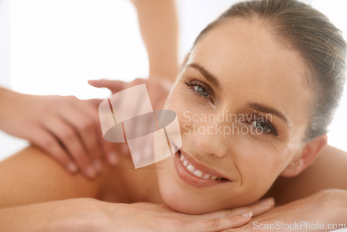 Image of Woman, portrait and smile for massage or hands for spa treatment stress relief at resort, physical therapy or peace. Female person, face and relax service in Hawaii for skincare, vacation or comfort