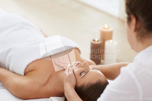 Image of Woman, massage and physical therapy or relax spa treatment at holiday resort or luxury care, service or stress relief. Female person, masseuse and candles for calm vacation, comfortable or skincare