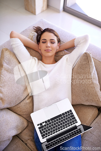 Image of Woman, nap and laptop for remote work in home, burnout and rest on couch for mental health. Female person, overworked and dream in sleep for fatigue or exhausted, freelancer and relax in living room