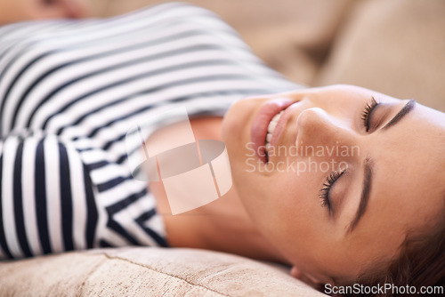 Image of Woman, sleep and weekend to relax on couch, dream and smile while lazy or comfortable in home. Female person, happy and nap on sofa in living room, closeup and calm for health and tired or exhausted