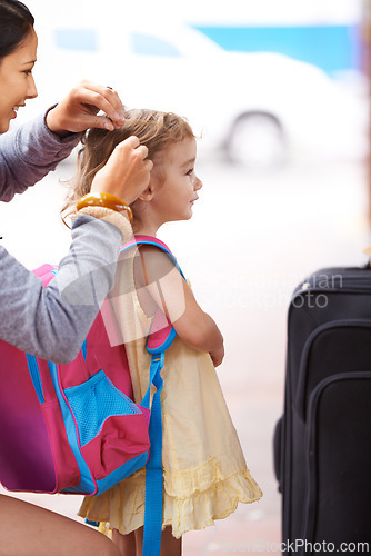 Image of Mother, child and hair with suitcase travel or waiting at airport for journey to America, adventure or outdoor. Female person, daughter and backpack for family holiday or flight, delay or transport