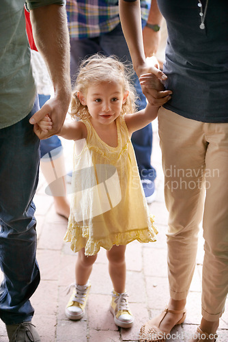 Image of Happy, young girl and family holding hands for travel, fun adventure or holiday weekend in nature. Excited child, mom and dad walking outdoors for sightseeing, bonding and field trip together